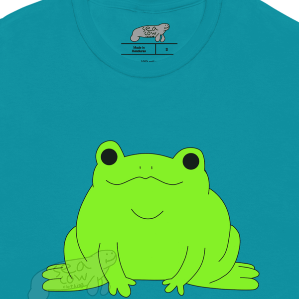 Blue t-shirt with a green frog graphic on a white background