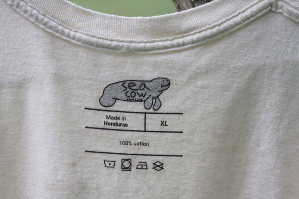 Gray t-shirt with a graphic of a 'sea cow' and text on the fabric.